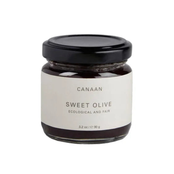 A photo of a jar of Sweet Olive. The jar says 'ecological and fair' from Canaan Palestine.