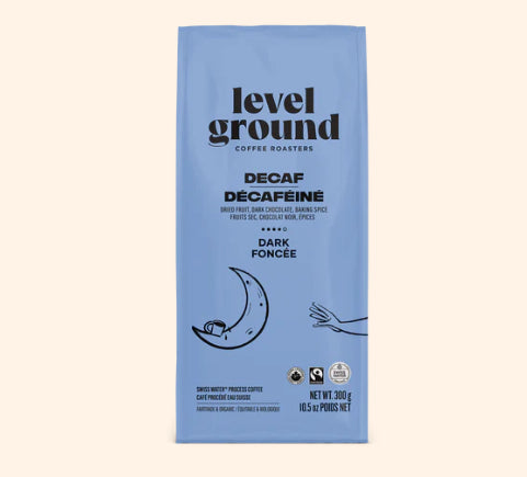 A photo of a bag of coffee with a moon on the blue bag. This is Level Ground Coffee's 'Decaf' Dark Roast. 