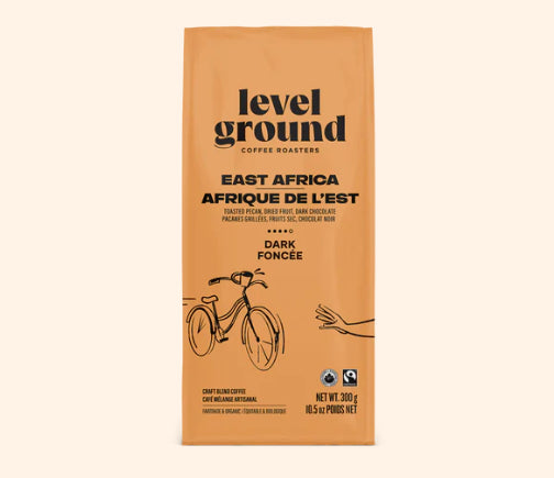 A photo of a bag of coffee with a bicycle on the orange bag. This is Level Ground Coffee's 'East Africa' Dark Roast. 