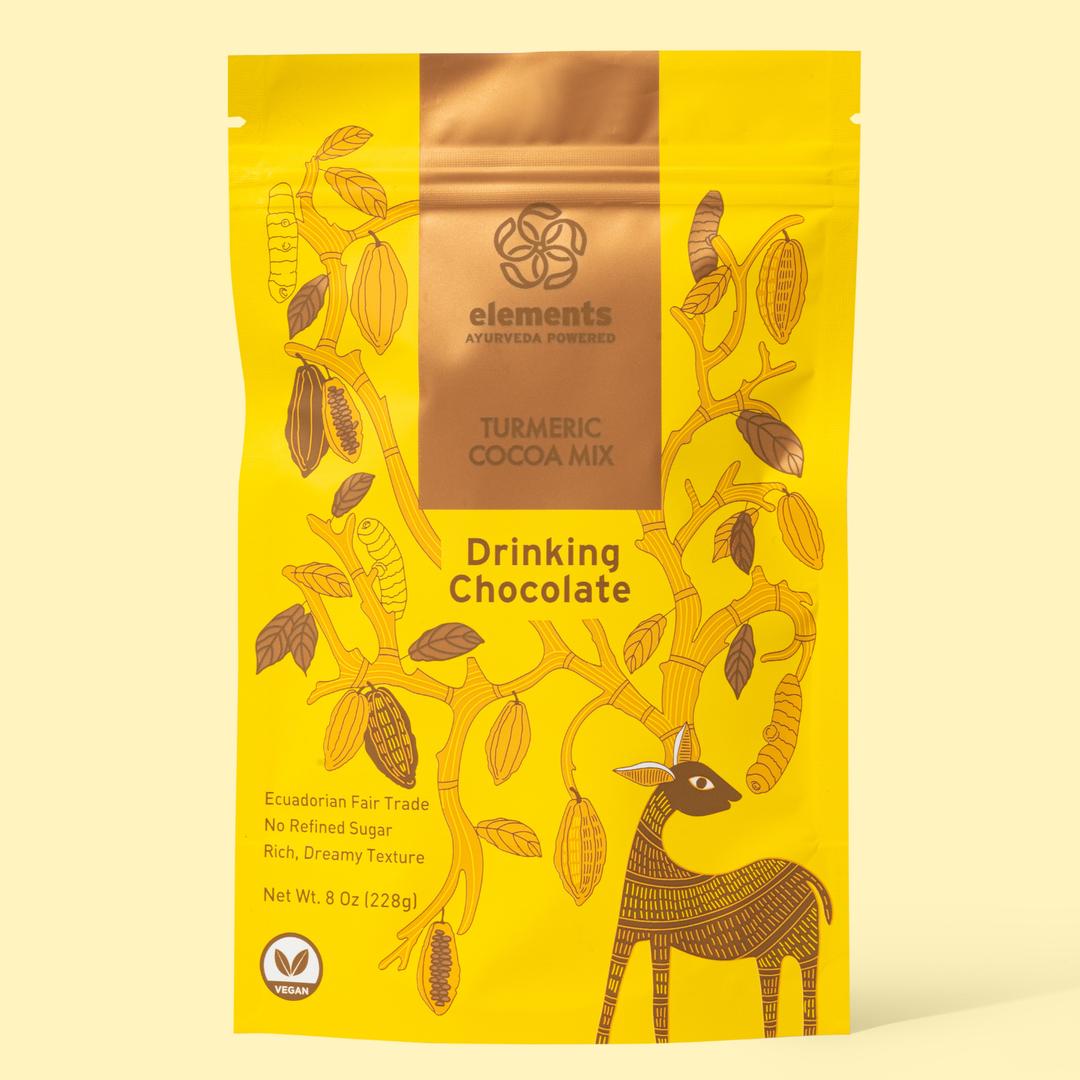 Photo is of a yellow bag labeled with Elements Turmeric Cocoa Mix Drinking Chocolate