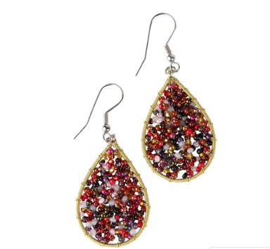 A photo of beaded earrings from Guatemala. These ones are in an ember color tone and are a teardrop shape. 