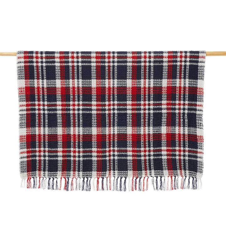A photo of a plaid throw in Red, White, and Blue that is beautifully handcrafted in India. 