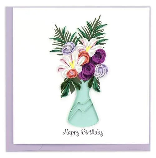 A photo of an intricately quilled greeting card made in Vietnam.  This card featured a beautiful vase full of flowers and 'Happy Birthday' is written across the bottom. 