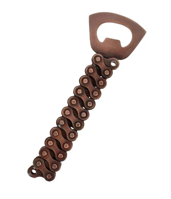 A photo of a bottle opener that is made of brass from India from recycled bike chain parts. 
