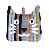 A photo of a pot holder made in Guatemala in the shape and designed of a cat face.