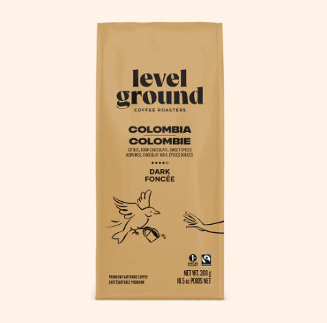 A photo of a bag of coffee with a bird on the teal bag. This is Level Ground Coffee's 'Colombia' Dark Roast. 