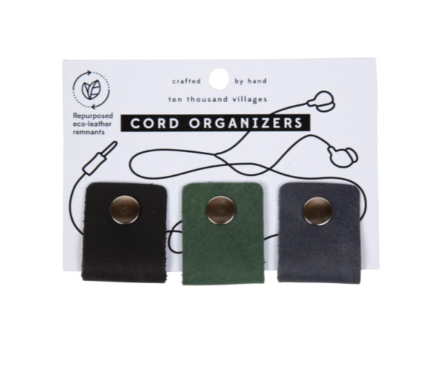 A photo of a set of cord organizers made from repurposed eco-leather remnants. This is a trio pack with different colored leather snap organizers, this one has black, dark green, and navy blue. 