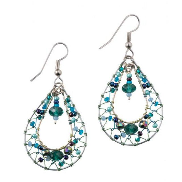 A photo of a pair of earrings that are silver hoops with a smaller hoop inside with blue and green beads woven back and forth between the hoops, and a dangle string of beads in the center. 