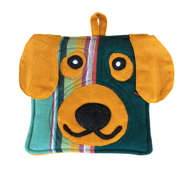 A photo of a pot holder made in Guatemala in the shape and designed of a dog face.