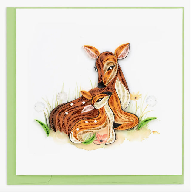 A photo of an intricately quilled greeting card made in Vietnam. This card features a fawn with her doe cuddled into her. 