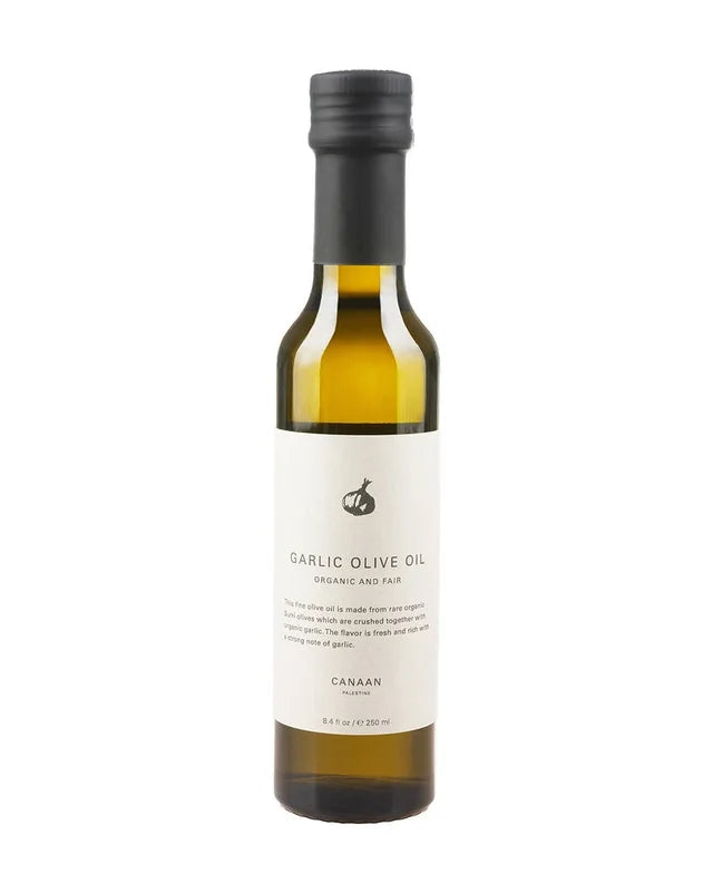 A photo of a bottle of Garlic Olive Oil. Organic and Fair Trade, this olive oil comes from Palestine. 