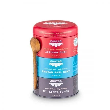 A photo of a tea trio from Justea. The tea comes in a 3 pack canister with a wooden spoon. This is the black tea trio with African Chai, Kenyan Earl Grey, and Mt. Kenya Black.