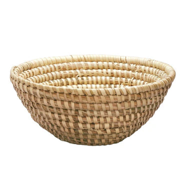 A photo of a medium kaisi basket. This basket is woven from Kaisi grass in Bangladesh and has a very neutral look. 