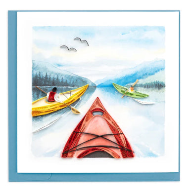 A photo of a greeting card made of quilling art from Vietnam. This card features a kayaking scene with 3 kayaks riding down a lake on the front.