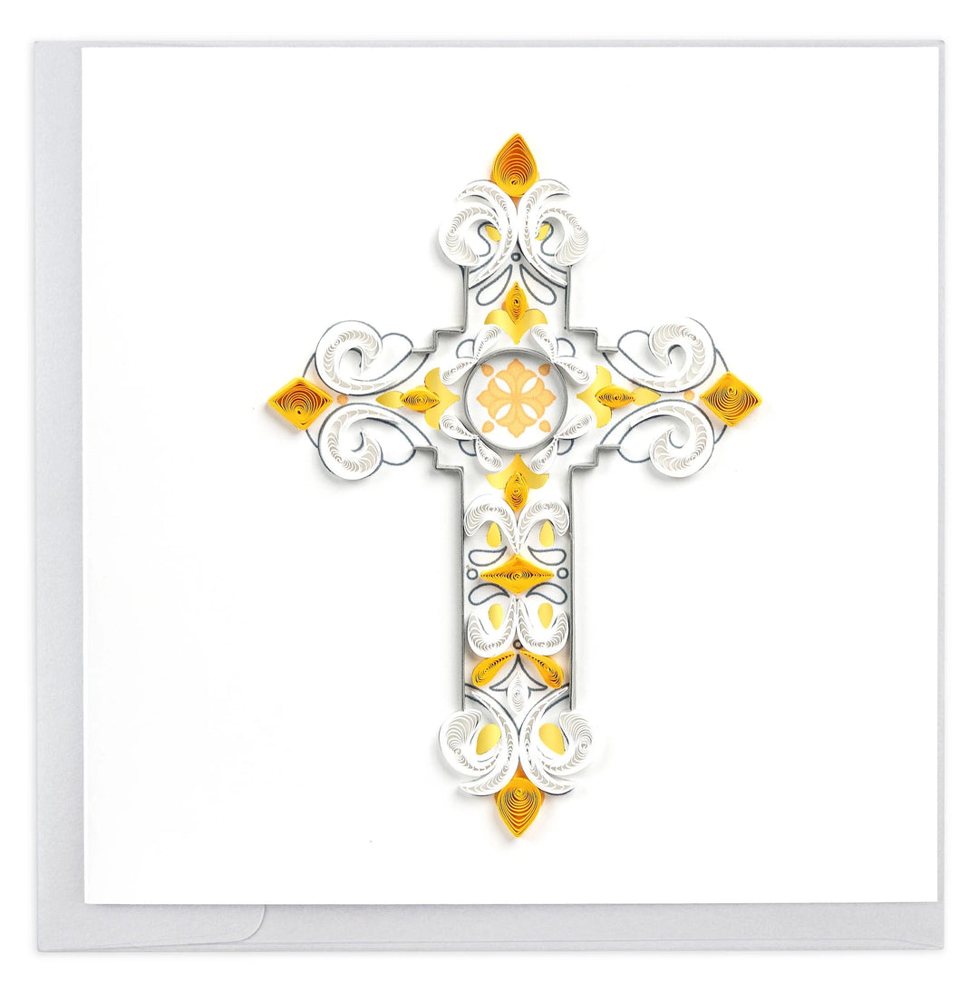 A photo of an intricately quilled art greeting card made from swirling paper in Vietnam. This card featured a gold colored and white cross with swirls and details throughout. 