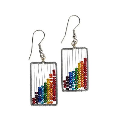 A photo of a pair of earrings that are wire and beaded in Guatemala. This design is just like an abacus in rainbow colors! 