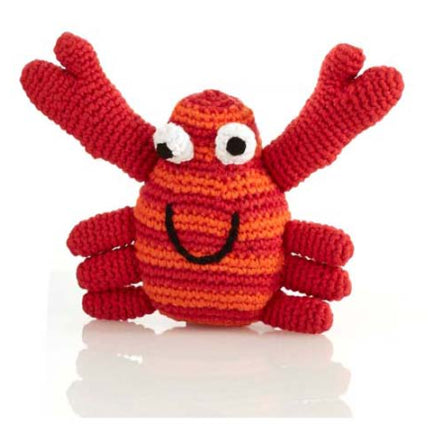 A photo of a hand crocheted rattle made in Bangladesh. This one is a crab