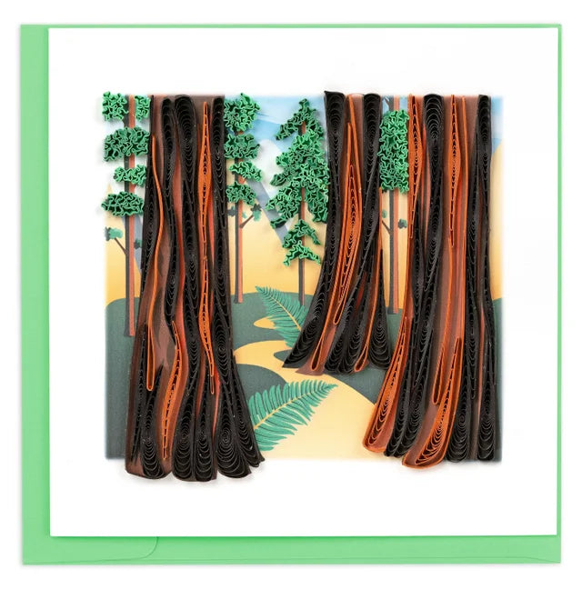 A photo of an intricately quilled art greeting card made from swirling paper in Vietnam. This card featured huge redwood trees in the foreground and background making a gorgeous card into a piece of art with the quilling craft. 