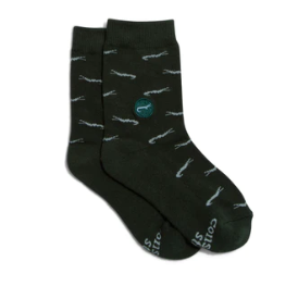 A photo of a pair of green kids socks adorned with crocodiles that help save crocodiles through non-profit donations with each purchase of these fair trade socks made in India.
