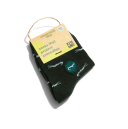 A photo of a pair of green kids socks adorned with crocodiles that help save crocodiles through non-profit donations with each purchase of these fair trade socks made in India.