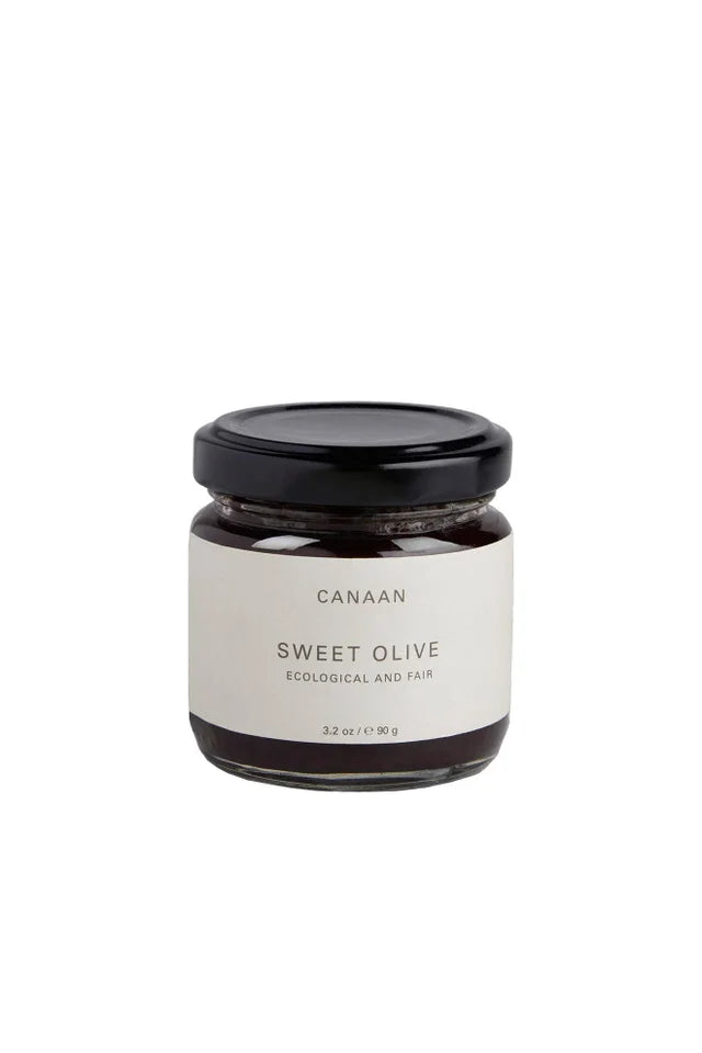 A photo of a jar of Sweet Olive. The jar says 'ecological and fair' from Canaan Palestine. 
