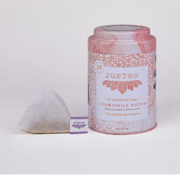 A photo of a container with tea bags from Justea. This is the Chamomile Dream Herbal Tea. 