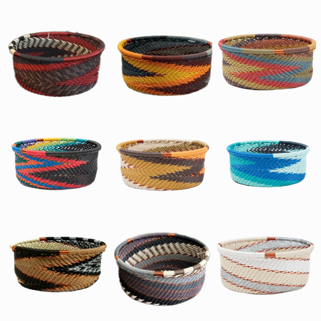A photo of a collage of 9 small dishes weaved like a basket made out of telephone wire with an assortment of colors. 