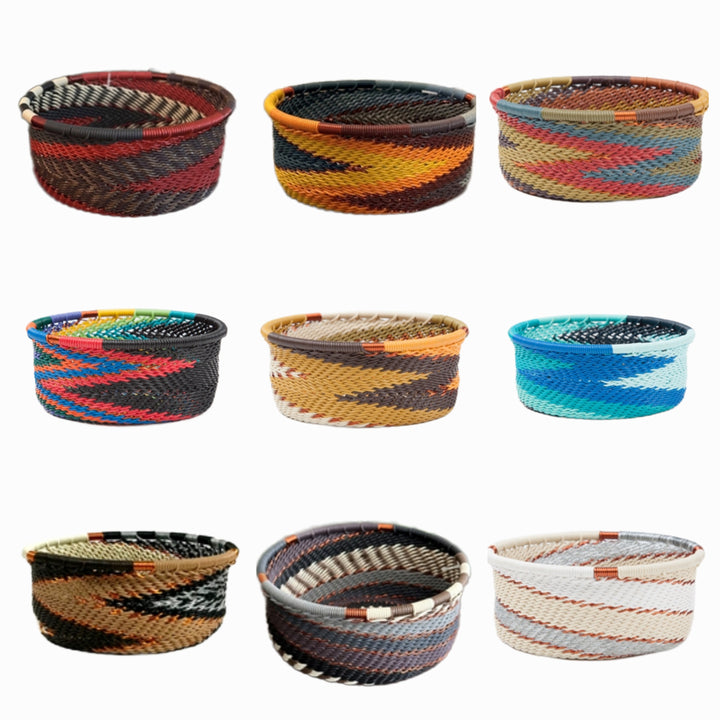 A photo of a collage of 9 small dishes weaved like a basket made out of telephone wire with an assortment of colors. 