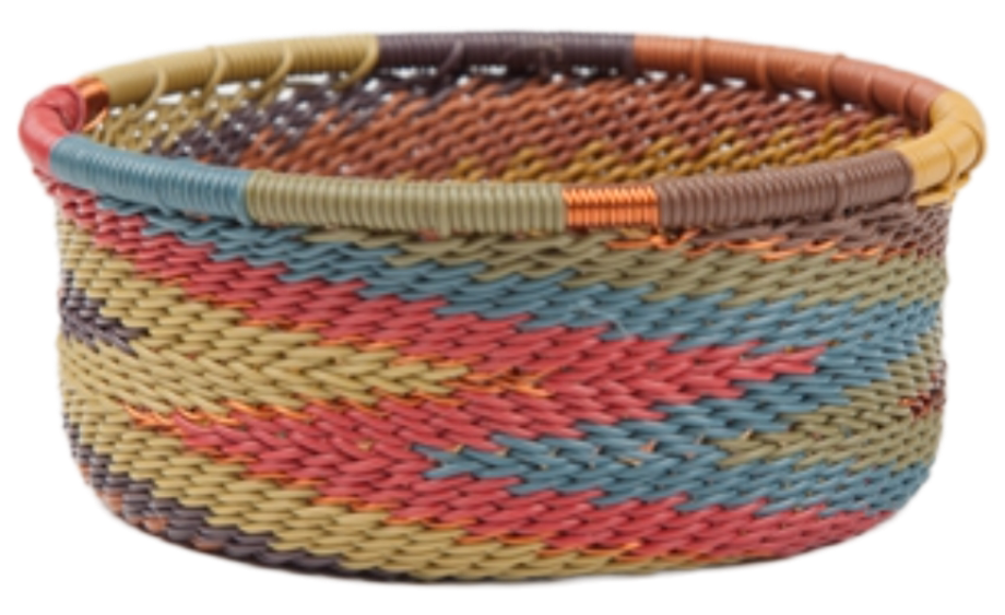 A photo of a small dish that is weaved like a basket made out of telephone wire with deep muted colors of blue, green, red, copper, and tan.