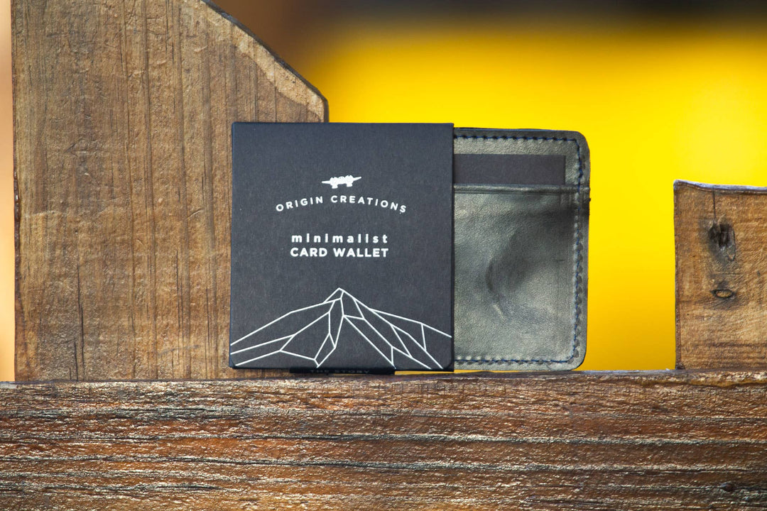 A photo of a black minimalist wallet made of ethical leather in Nicaragua. 