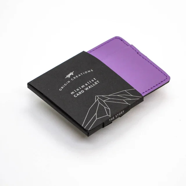 A photo of a purple minimalist wallet made of ethical leather in Nicaragua. 
