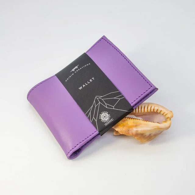 A photo of a purple wallet made of ethical leather in Nicaragua. 