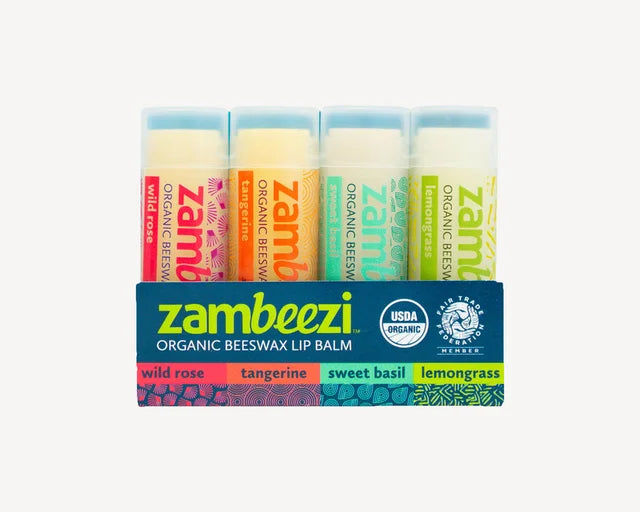 A photo of a 4-pack of Organic Beeswax lip Balm from Zambeezi from Zambia. This 4-pack features Wild Rose, Tangerine, Sweet Basil, and Lemongrass. 